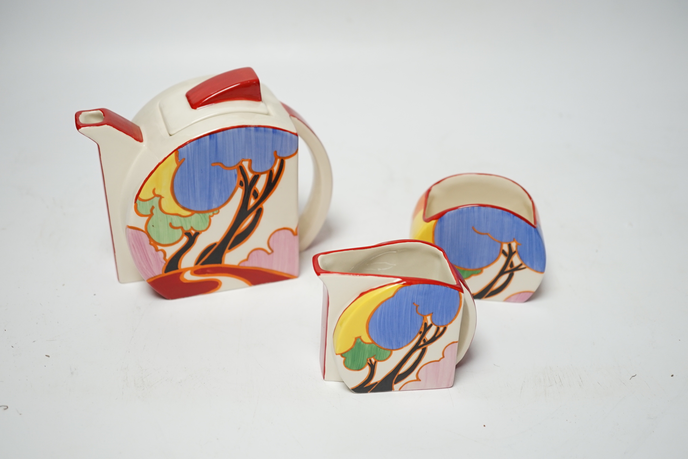 A Wedgwood Bizarre by Clarice Cliff Blue Autumn Stamford three piece tea set, limited edition with box and certificate, teapot and cover 12cm high